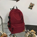 Burgundy minimalist laptop backpack with side compression straps and brand patch - Red