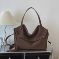 Vintage large dark brown matte leather tote bag with silver hardware on a metal shelf - Brown