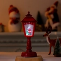 Red Christmas lantern lamp with glowing Santa scene and swirling snowflake glitter - Red Santa Claus