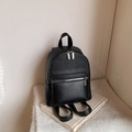 Minimalist black pebbled leather mini backpack with silver hardware for women - Black