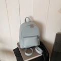 Light blue faux leather mini backpack with pebble texture and silver zipper details - Light Blue