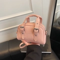 Pink patent leather mini square bag with decorative silver buckle straps and crossbody strap - Pink