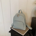 Light blue pebble grain leather backpack with dual zippers for school and travel - Light Blue