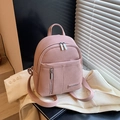 Pink lychee texture mini backpack with silver logo plaque and dual zipper pockets - Pink