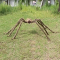 Giant Halloween plush spider decoration with red eyes and brown fur for outdoor lawn decor - Extra Large / Brown