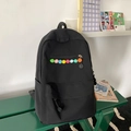 Minimalist black nylon backpack featuring colorful plush balls and multi-pocket design - Black without Pendant