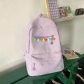 Lavender minimalist school backpack with colorful pom-pom detail on dark green bench - Purple Without Pendant