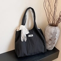 Black pleated tote bag featuring a white lace bow and LOVE patch detail - Black