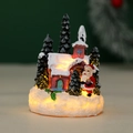 Detail shot of a lighted resin Christmas village house with Santa and snow effect - Santa Red House (YL2623C)