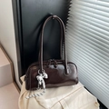 Vintage brown Boston shoulder bag with glossy patent leather and silver bow charm - Coffee With Pendant / Brown