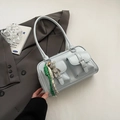 Light blue shoulder bag with multi-pocket design and cute bear charm accessory - With Charm / Blue