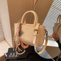 Creamy white vintage crossbody bag with woven rope charm and silver abacus pendant - Off-white