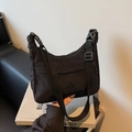 Minimalist black nylon dumpling shoulder bag with adjustable strap and embossed logo - Black