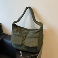 Padded olive green tote bag with quilted texture and dual front pockets for women - Green