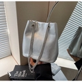 Detail of silver crinkled texture bucket bag with sleek dual chain shoulder straps - Silver