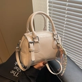 Chic cream white PU leather pillow bag with top handles and leaf charm detail - Off-White (With Pendant)