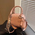 Pink minimalist pillow handbag with litchi grain texture and woven rope charm - Pink (With Pendant)