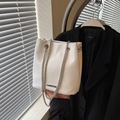 White leather bucket bag with silver chains and natural pleated texture for women - Off-white