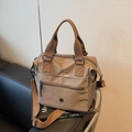 Khaki nylon tote bag with adjustable shoulder strap and metal logo for casual daily use - Brown