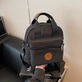 Bolso bandolera versátil de lona negra con bolsillo frontal y logotipo de bicicleta - Negro