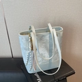 Chic light blue leather underarm bucket bag with star embossing and woven tassel detail - With Charm / Blue
