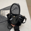 Classic black glossy faux leather tote bag with gold hardware and shoulder strap - Black