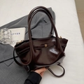Dark brown glossy leather tote bag with gold buckle and adjustable shoulder strap - Coffee