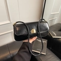 Minimalist black glossy patent leather underarm bag with elegant gold metal lock - Black
