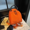 Fashionable orange shell backpack with woven handles and high-density nylon texture - Orange