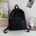 Black minimalist backpack with subtle floral texture and multiple zip pockets - No Pendant / Black