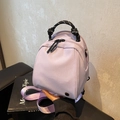 Mini lavender shell-shaped backpack with woven handle and purple satin straps - Taro