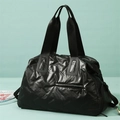 Large capacity black sports duffel bag with textured finish and adjustable strap - Black