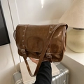 Deep brown vintage messenger bag in polished PU leather with silver eyelet buckle straps - Brown