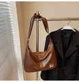 Detail view of large brown matte leather hobo bag with wide strap and metal hardware - No Pendant / Brown
