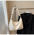 Detail of white PU leather hobo bag with adjustable strap and metal hardware plaque - No Pendant / Off White