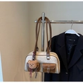 Detail of canvas tote bag with brown leather pockets and a cute plush bear charm - Cream White With Pendant
