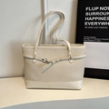 Creamy beige woven tote bag with smooth leather handles and metal lobster clasp detail - Off White