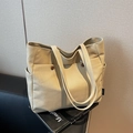 Beige canvas tote bag with side pockets and button compartment for daily commuting - Off White