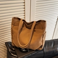 Dark brown canvas tote bag with multi-pocket design and wide shoulder straps - Brown