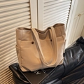 Khaki canvas tote bag with front snap pockets and side pockets in a stylish design - Khaki