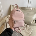 Mini pink vintage backpack with twill texture and silver zippers in a stylish setup - Pink
