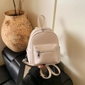 Chic beige woven mini backpack with leather trim and adjustable straps for women - Beige