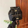 Black quilted leather backpack with gold chain trim and metallic turn-lock closure - Large / Black