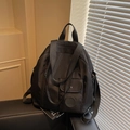 Black waterproof nylon backpack with multi-pocket design and adjustable straps - Black