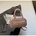 Detail view of pink Boston bag showing smooth PU leather texture and curved zipper pockets - One Size / Pink