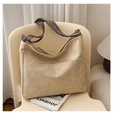 Detail view of large vintage hobo bag with ethnic style wide woven shoulder strap - Beige