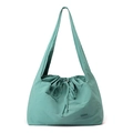 Detail view of the mint green waterproof nylon fabric texture and drawstring closure - Azure Green