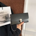 Classic black matte leather chain crossbody bag with silver rotating metal lock closure - Black