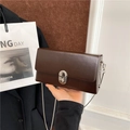 Dark brown rectangular box bag with silver chain strap and metallic lock clasp - Brown