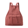 Detail of brick red drawstring backpack with contrast white stitching and silver eyelets - Berry Red